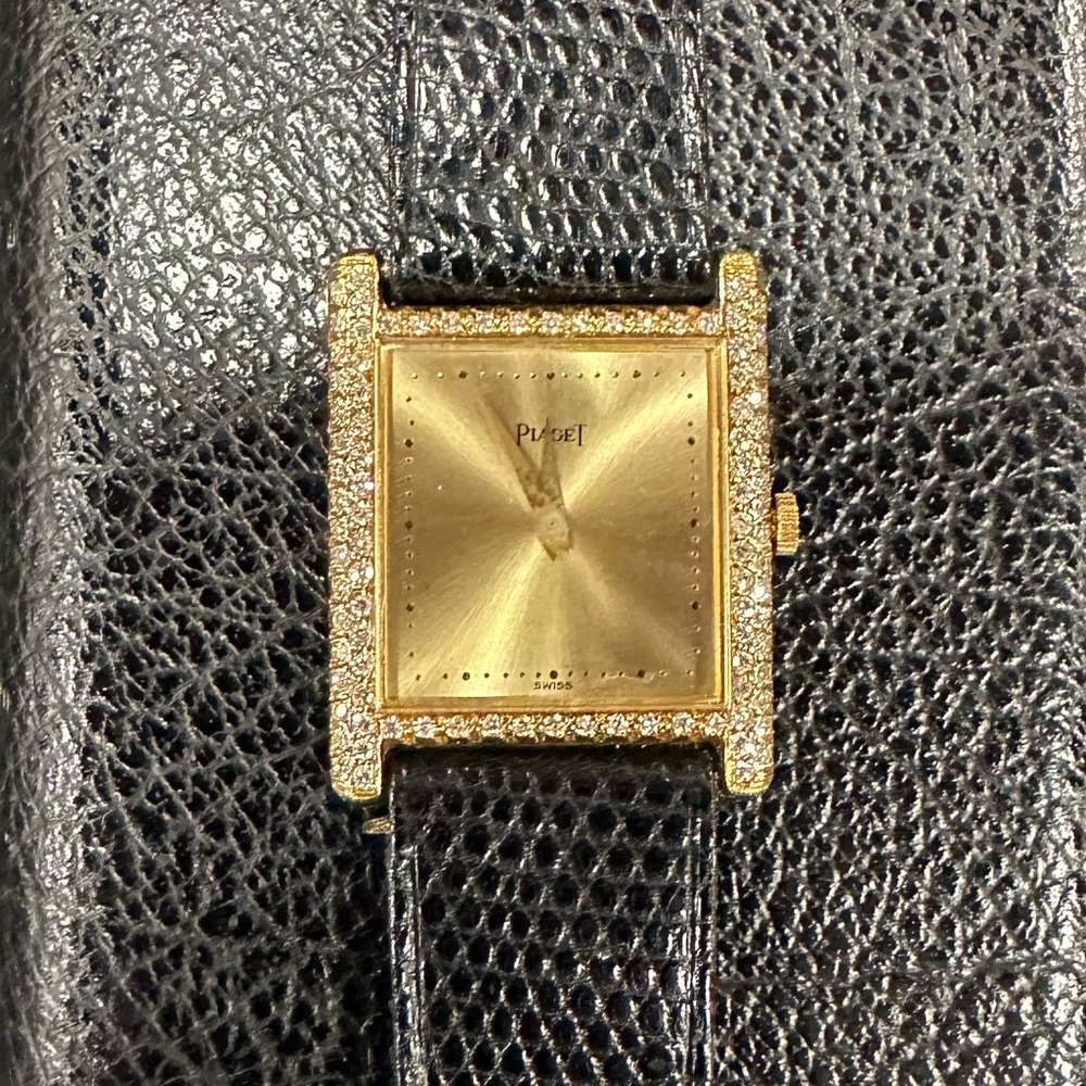 Piaget 18k Tank Watch with Diamonds on the case.  Manual wind movement 1980’s